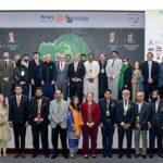 President Dr. Arif Alvi in a group photo at the Climate Change Conference by Rotary International District 3271