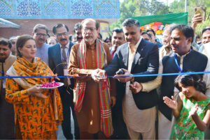 Caretaker Sindh Minister for Information Ahmad Shah cutting the ribbon to inaugurate Shah Latif Festival for Children at Sindh Museum