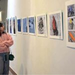 Visitor taking keen interest in the photographs during the “Mountain Photographic Exhibition” organized by Pakistan Tourism Development Corporation (PTDC) on the occasion of International Mountain Day 2023 at Pakistan Nation Council of Arts (PNCA)