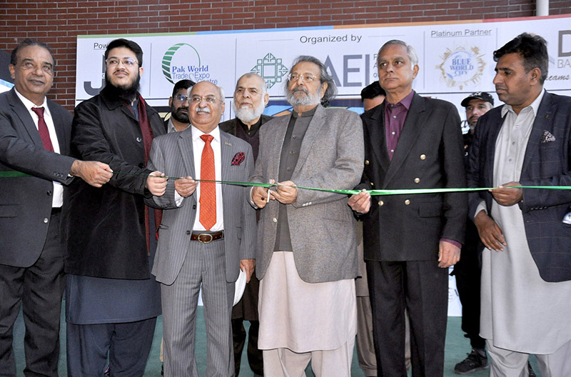 Federal Minister for Education Professional Training Madad Ali Sindhi cutting ribbon during the opening ceremony of 3rd Pakistan International Property housing & Construction Expo-23 at Pak China Friendship Center