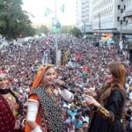 Folk singer performing Sindhi song during celebration of Sindhi Ajrak Topi Culture Day at Karachi Press Club