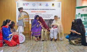 Students performing drama on stage during the closing ceremony of the 16 Days of Activism Against Gender-Based Violence, organized by the Khyber Pakhtunkhwa Commission on the Status of Women KPCSW. 