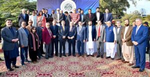 Caretaker Prime Minister Anwar ul Haq Kakar in a group photo with senior member doctors of the Association of Physicians of Pakistani Descent of North America (APPNA) at the 46th Winter Khyber Medical College Convention organized in collaboration with APPNA
