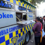 Traffic warden making driving licenses through DL-Van for Christian community on the Christmas day at Saint John's Cathedral Church