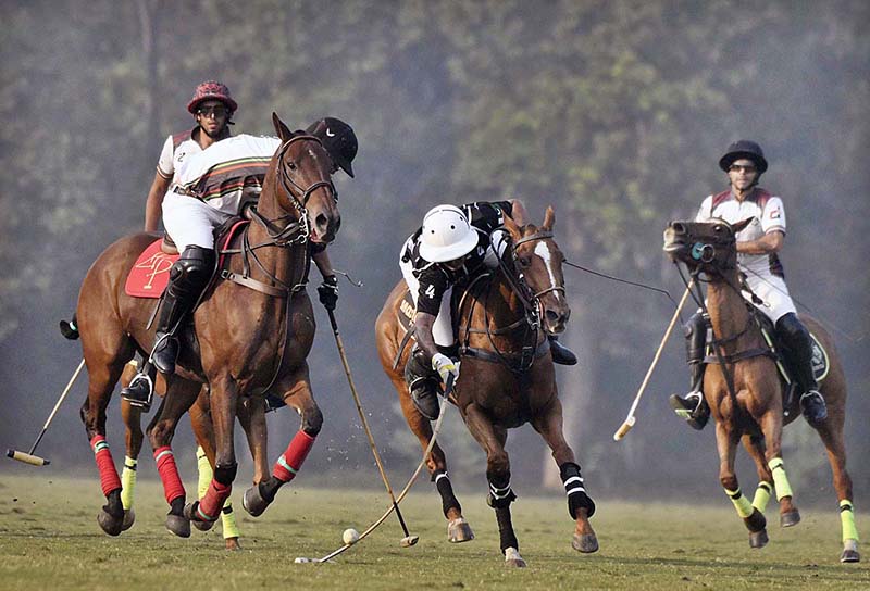 Players struggling to get hold on the ball during Polo match between Master Paints and FG Din Polo during Hamadan 12th Lahore Open Polo Championship 2023 at Lahore Polo Club