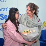 First Lady Begum Samina Arif Alvi presented a bouquet by organizers at a ceremony in connection with International Disability Day