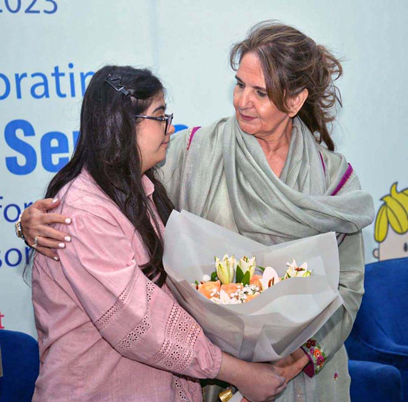First Lady Begum Samina Arif Alvi presented a bouquet by organizers at a ceremony in connection with International Disability Day