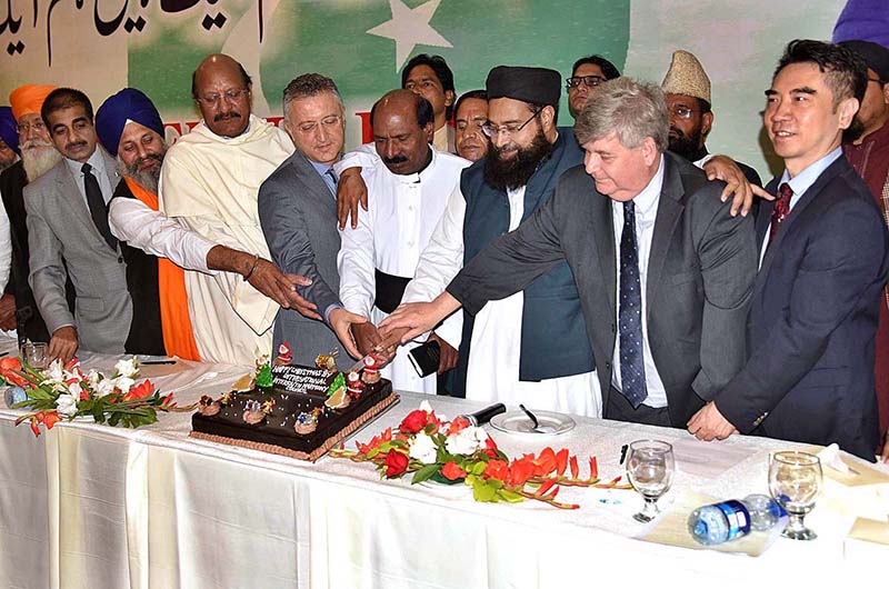 Special Assistant to the Prime Minister on Interfaith Harmony Maulana Tahir Ashrafi, Turkish Consul Journal Durmus Basttug ,and Chinese Consul General Director Mr DU YUE cutting cake during the Interfaith Harmony Conference at a local hotel.