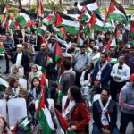 Activists of Civil Society holding Palestine Flags and placards during a protest demonstration to show solidarity with the people of Palestine and take part in an anti-Israel demonstration at Liberty Chowk