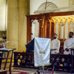 Christian community members performing religious rituals on Christmas Day at The Holy Trinity Cathedral Church