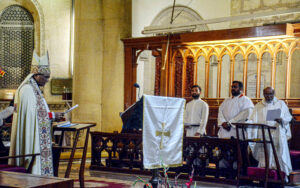 Christian community members performing religious rituals on Christmas Day at The Holy Trinity Cathedral Church