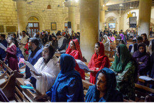 Christian community members performing religious rituals on Christmas Day at The Holy Trinity Cathedral Church