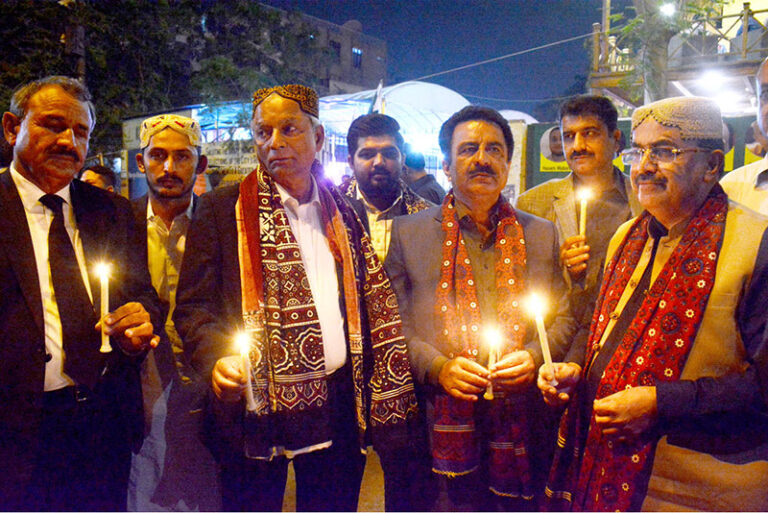 People light candles on the eve of Sindhi culture Day