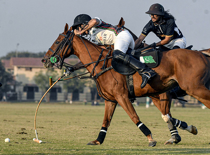 Players struggling to get hold on the ball during semi Final match between FG DIN Polo VS Master Paints Newage Cables in 4th Allama Iqbal Polo Cup 2023 at Jinnah Polo Fields