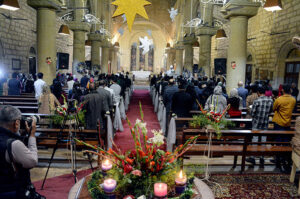 Christian community members performing religious rituals on Christmas Day at The Holy Trinity Cathedral Church
