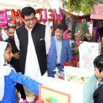 Deputy Commissioner Javaid Ahmed Kumbhar along with Director Schools Education Primary Gulshir Soomro and District Education Officer Primary Anees Rehman Jalbani visiting different stalls during the first annual Science, Arts and Cultural Exhibition 2023, organized by District Education Office at Government Boys Primary School Sachal Colony