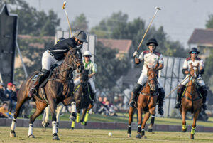 Players struggling to get hold on the ball during semi Final match between FG DIN Polo VS Master Paints Newage Cables in 4th Allama Iqbal Polo Cup 2023 at Jinnah Polo Fields