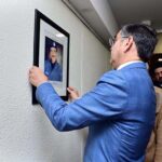 Caretaker Prime Minister Anwaar-ul-Haq Kakar while inaugurating the Martyrs' Wall in the Ministry of Interior, placing a portrait of Shaheed AIG Safwat Ghayur