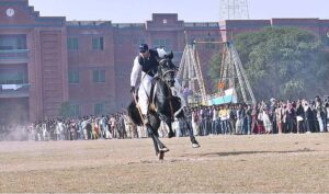 Horse riders are participating in a Tent-Pegging competition during the Winter Festival at MNS University