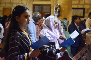 Christian community members performing religious rituals on Christmas Day at The Holy Trinity Cathedral Church