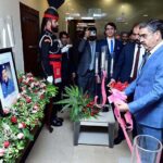 Caretaker Prime Minister Anwaar-ul-Haq Kakar while inaugurating the Martyrs' Wall in the Ministry of Interior, placing a portrait of Shaheed AIG Safwat Ghayur