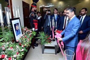 Caretaker Prime Minister Anwaar-ul-Haq Kakar while inaugurating the Martyrs' Wall in the Ministry of Interior, placing a portrait of Shaheed AIG Safwat Ghayur