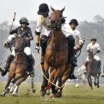 Players struggling to get hold on the ball during match between Rijas Polo vs DS Polo Sheikhoo steel in Hamadan 12th Lahore Open polo championship 2023 at Lahore Polo Club