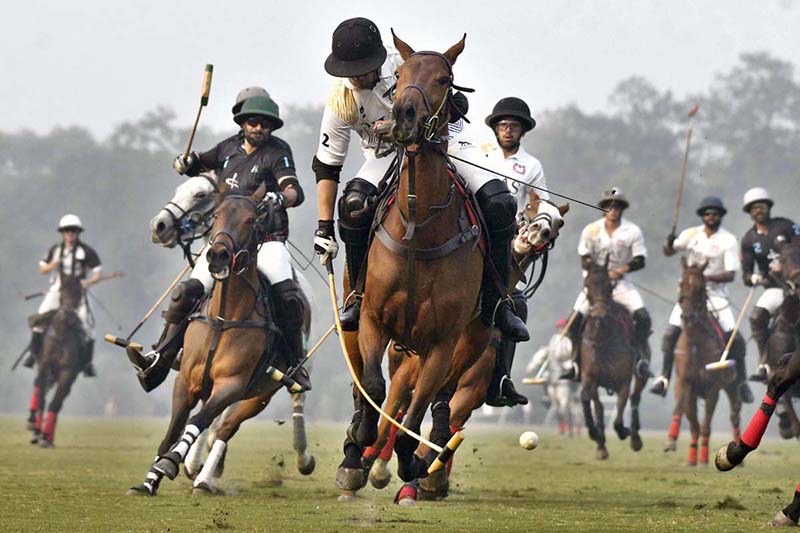 Players struggling to get hold on the ball during match between Rijas Polo vs DS Polo Sheikhoo steel in Hamadan 12th Lahore Open polo championship 2023 at Lahore Polo Club