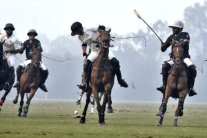 Players struggling to get hold on the ball during match between Rijas Polo vs DS Polo Sheikhoo steel in Hamadan 12th Lahore Open polo championship 2023 at Lahore Polo Club