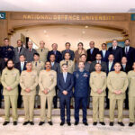 Caretaker Prime Minister Anwaar-ul-Haq Kakar in a group photo with the President, Directing Staff of National Defence University and graduating Civil Service officers of National Security Course-2024