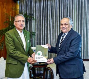 Chief Information Commissioner Mr. Shoaib Ahmad Siddiqui presenting the Bi-Annual Report 2023 of Pakistan Information Commission to President Dr. Arif Alvi, at Aiwan-e-Sadr