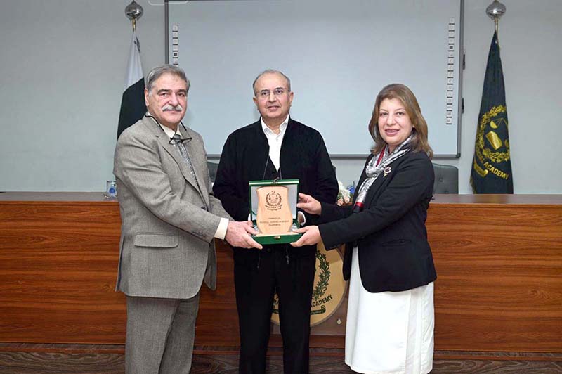 DG, FJA, Mr.Hayat Ali Shah presents a shield to DG, KP Judicial Academy, Ms Farah Jamshed during a ceremony at the Federal Judicial Academy. Mr.Justice Syed Mansoor Ali Shah, Judge, SCP also seen in the picture