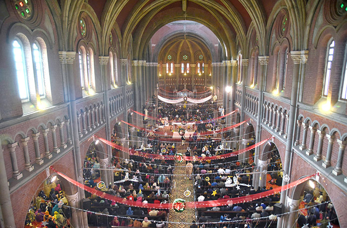 Christian community members performing religious rituals on the occasion of Christmas Day a St. Anthony's Church, in the City