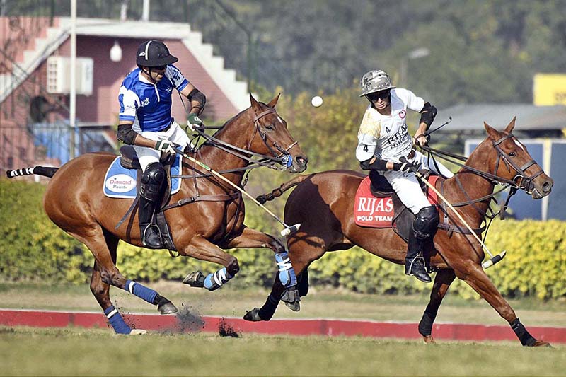 Players struggling to get hold on the ball during polo match played between RIjas Polo vs. Diamond Paints Platinum Homes during Hamadan Lahore Open Polo Championship 2023