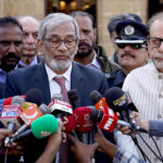 Caretaker Sindh Chief Minister Justice (Retired) Maqbool Baqir along with Caretaker Provincial Minister for Information and Minorities, President Karachi Arts Council, Muhammad Ahmed Shah talking to media during their visit to St Petrich Cathedral Church on the eve of Christmas Day celebrations