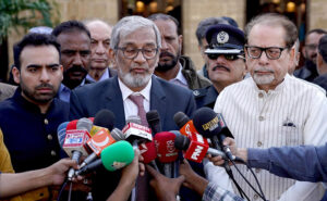 Caretaker Sindh Chief Minister Justice (Retired) Maqbool Baqir along with Caretaker Provincial Minister for Information and Minorities, President Karachi Arts Council, Muhammad Ahmed Shah talking to media during their visit to St Petrich Cathedral Church on the eve of Christmas Day celebrations