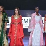 Models presenting the dresses designed by Turkish designer Cemile Gul at Turkiye 100th Anniversary Celebration event