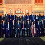 Caretaker Prime Minister Anwaar-ul-Haq Kakar in a group photo with business leaders and heads of best performing companies at the Pakistan Stock Exchange