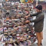 A vendor selling mobile accessories at Commercial Market.