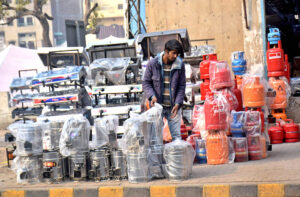 A local vendor displaying Gas and wooden stoves to attract the customers at the roadside. 