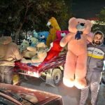 Vendor displaying teddy bear to attract the customers at Shamsabad.