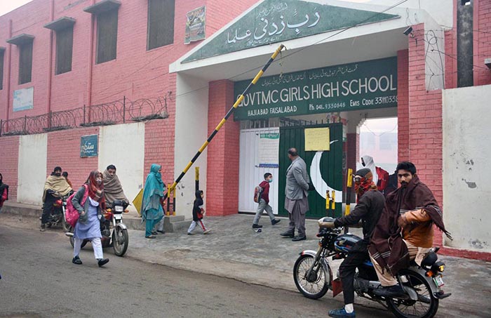 Children on the way to their school as educational institutions are reopened after winter vacations.