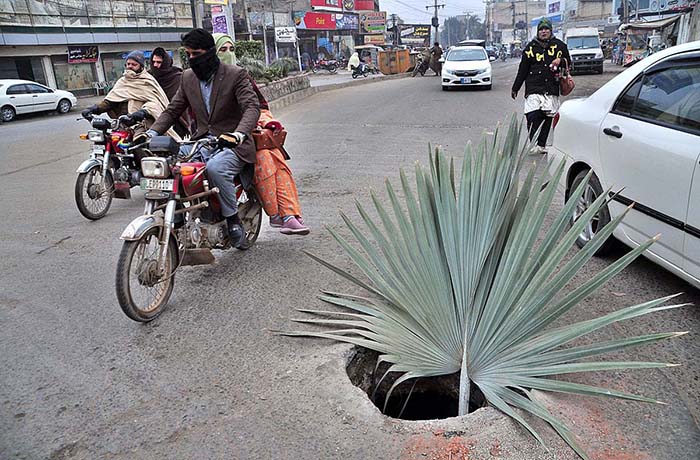 A view of open main hole at Khayam Chowk may cause any mishap and needs the attention of concerned authorities.