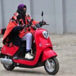 A female on the way while riding scooty at Stadium Road