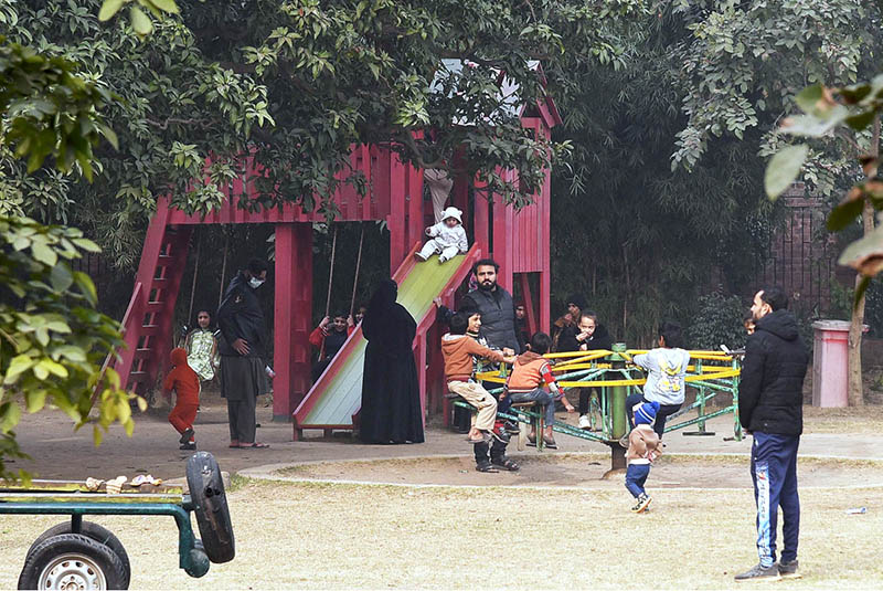 Children enjoy swings at Local Park in the city