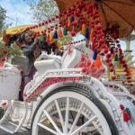 A worker busy in decorating horse cart to be hired for wedding ceremony
