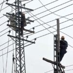 WAPDA workers busy in repairing electric wires at Naranwala Road to ensure uninterrupted power supply.