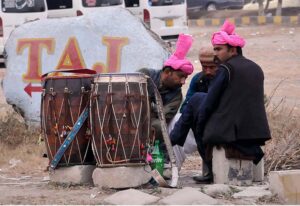 Traditional drummers sitting on roadside waiting for clients to get hired for functions at F-11 Margala Road