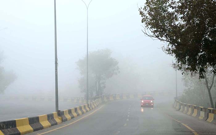A view of thick fog that engulfs the whole city during morning time in the Federal Capital.