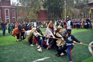 Teachers and Students participating in the Tug of War game in the annual Sports Gala during the 10 Years celebrations of The Women's University.